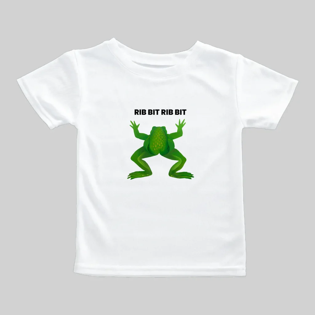 White t-shirt with a green frog graphic and the text "KISS MY FROG".