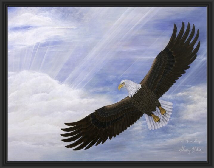 A bald eagle soaring high with sun rays breaking through clouds.