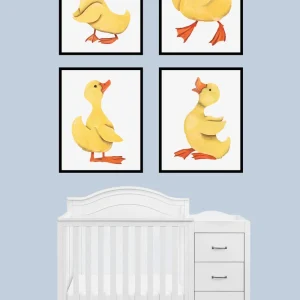 Four cartoon duck prints above a white baby crib in a nursery room.