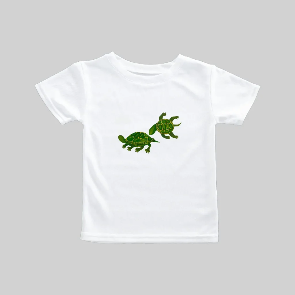 White t-shirt with a small green dinosaur graphic on the front.