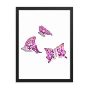 Three pink butterflies with intricate designs framed on a white background.
