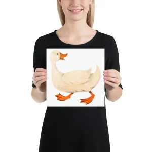 Woman holding a picture of a cartoon duck.