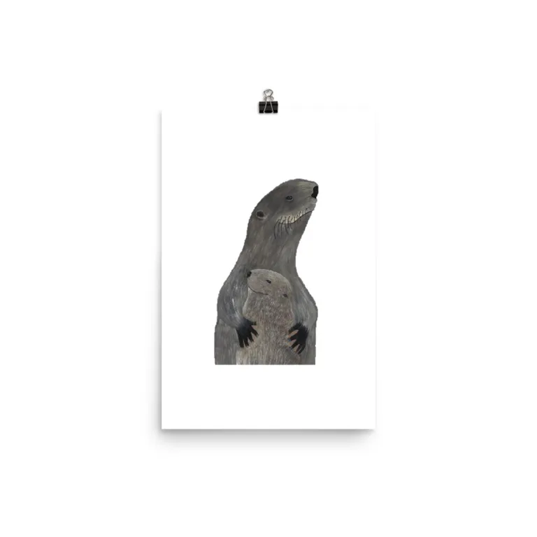 Abstract sculpture mounted on a white wall with a small hanging element.