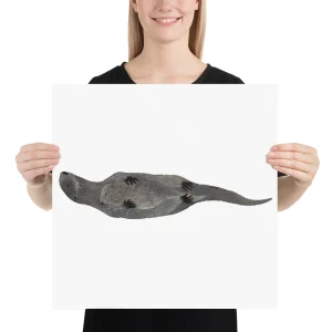 Person holding a poster of a platypus illustration.