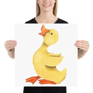 A person holding a poster with a cute yellow duck illustration.