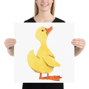 Person holding a poster with a cartoon yellow duck illustration.