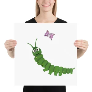 Person holding a sign with a cartoon caterpillar and a butterfly illustration.