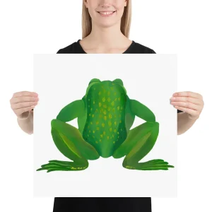 Person holding a poster of a large green frog illustration.