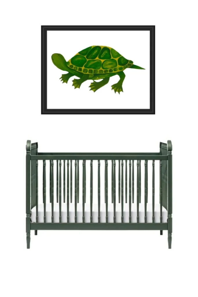 Green crib beneath a framed turtle picture in a nursery.