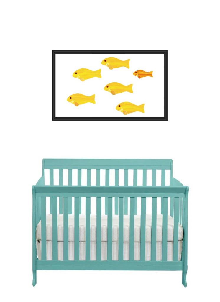 A nursery wall decal of yellow fish above a teal crib.