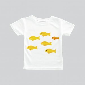 White t-shirt with yellow fish prints, one orange fish stands out.