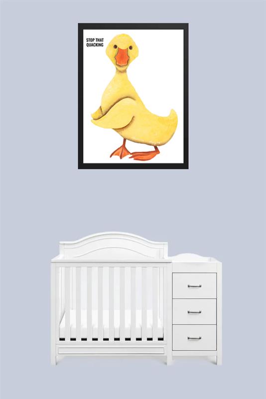A cozy baby nursery with a white crib and duck artwork.