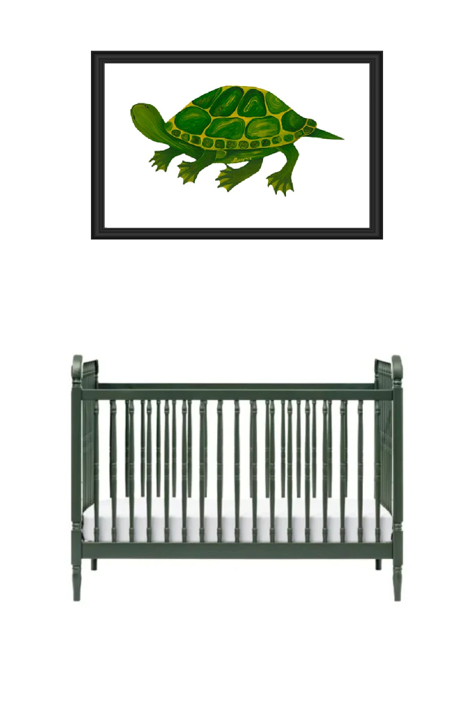 A green crib beneath a framed alligator illustration.